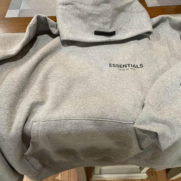 Essentials hoodie brand new it runs big so if your xl this would perfect.